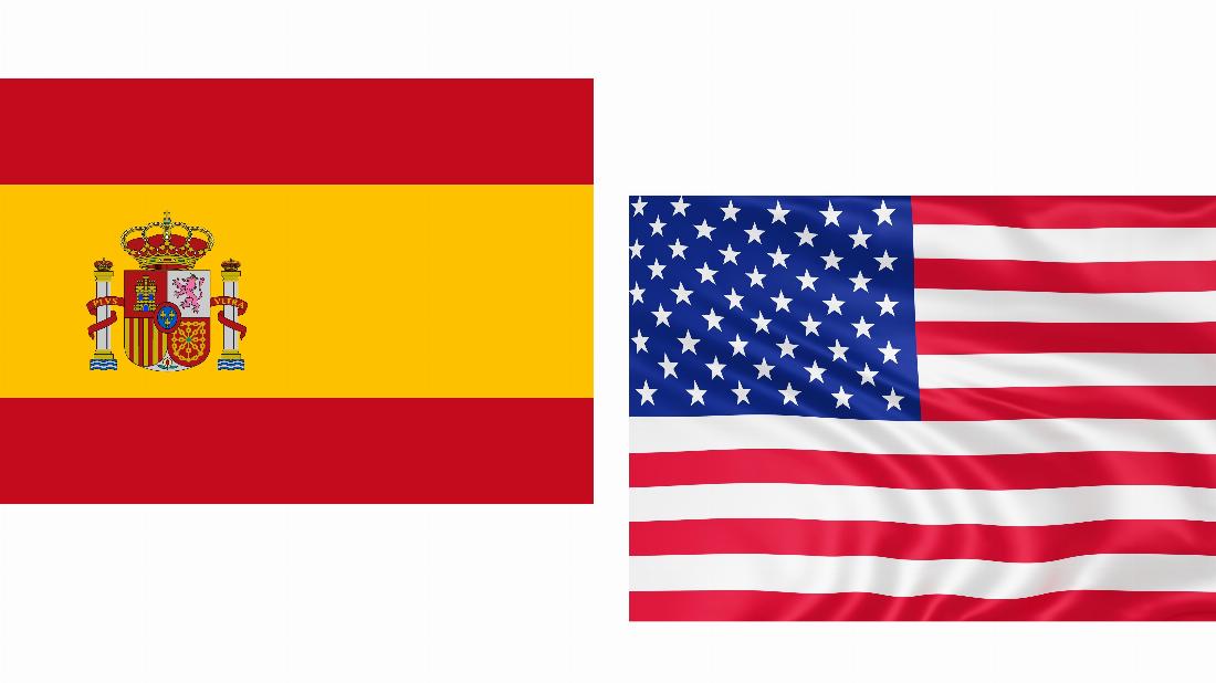 spanische und US-amerikanische Flagge nebeneinander